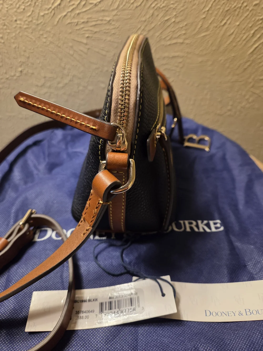 Dooney & Bourke NWT Black Pebble Leather Crossbody with Brown Trim. Logo charms